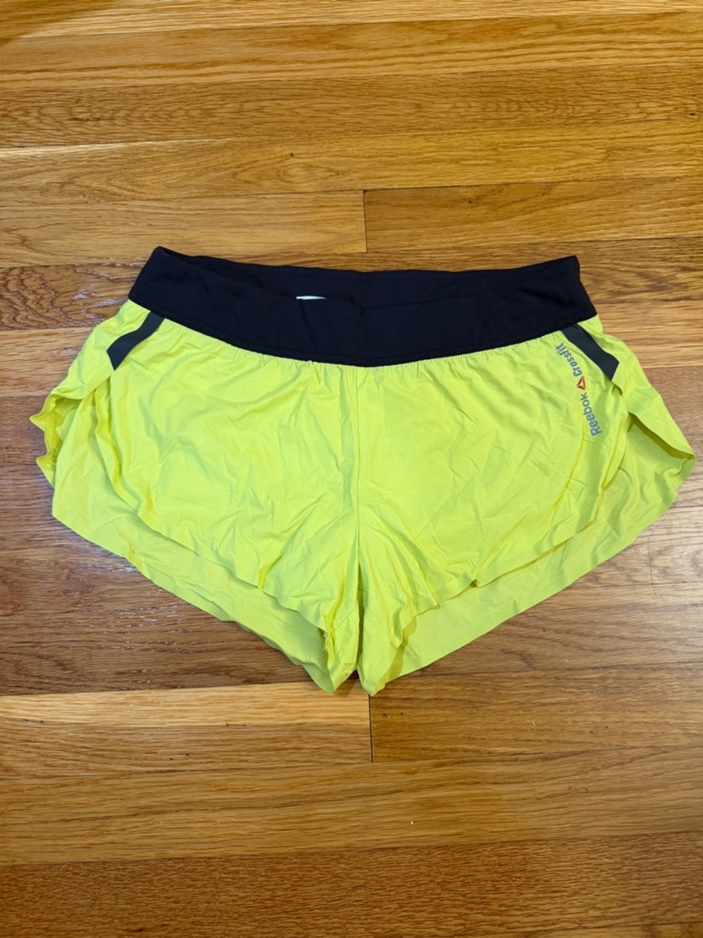 Reebok Les Mills Speedwick Athletic Shorts in Yellow/Black - Size Small